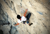 Wes Green resting before the big throw on Bottom Feeder 5.12d, The Surf Bowl.